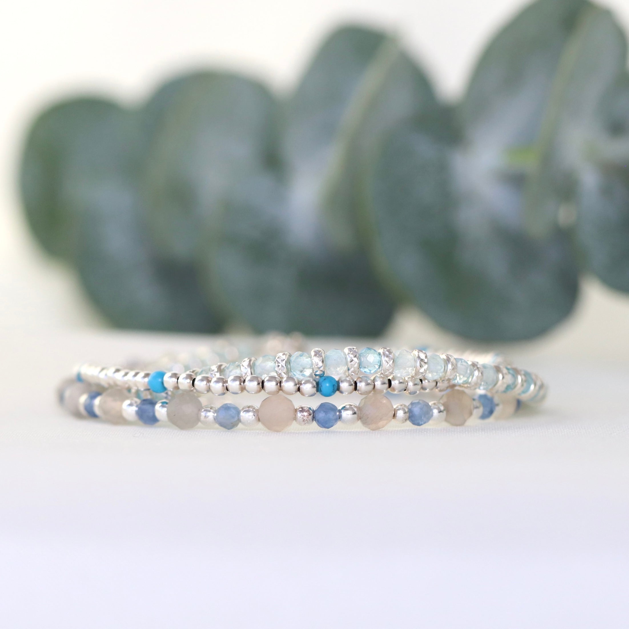 Blue Topaz bracelet with 925 sterling silver sparkling accents, handmade by Oberia Jewelry