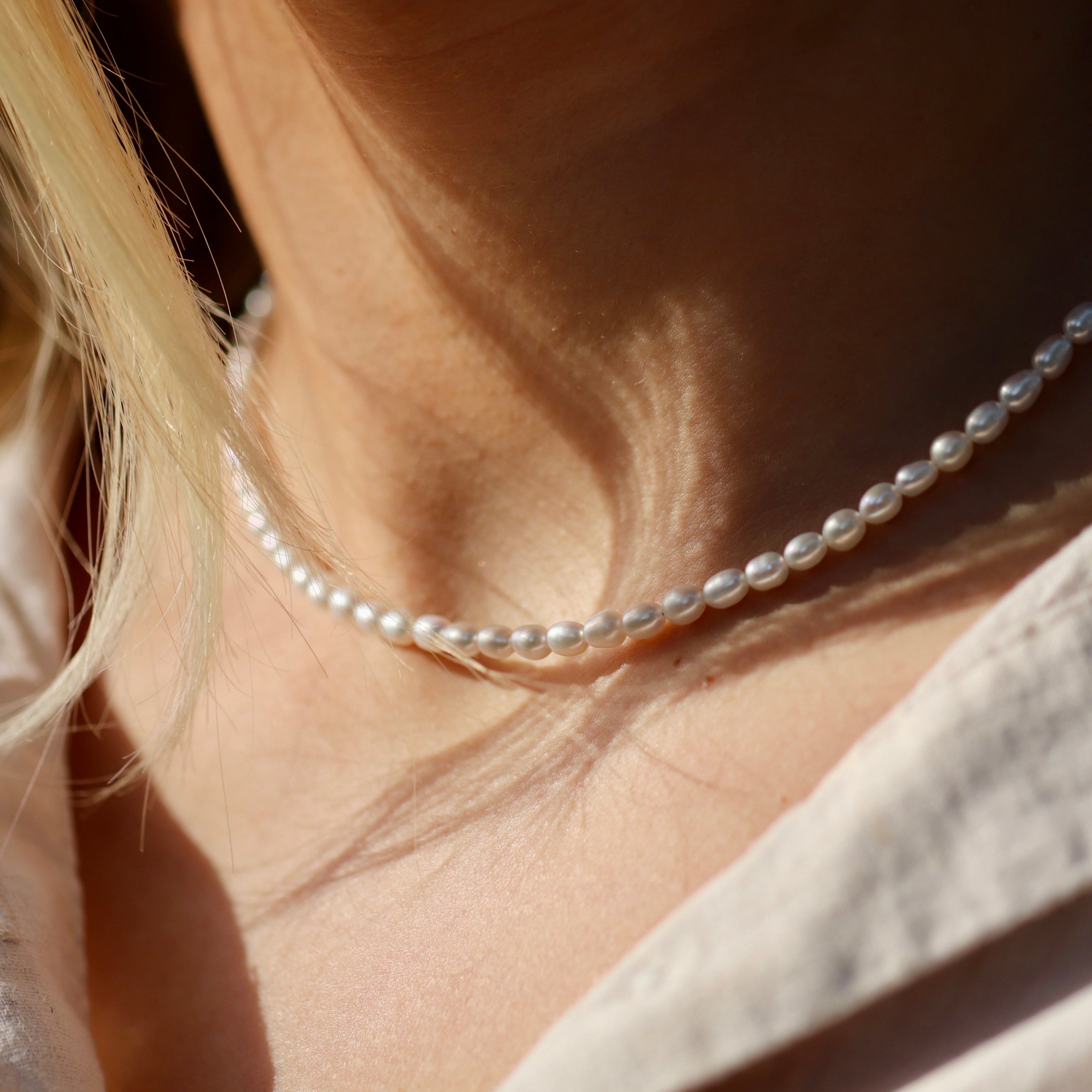 Dainty freshwater rice pearl necklace by Oberia Jewelry