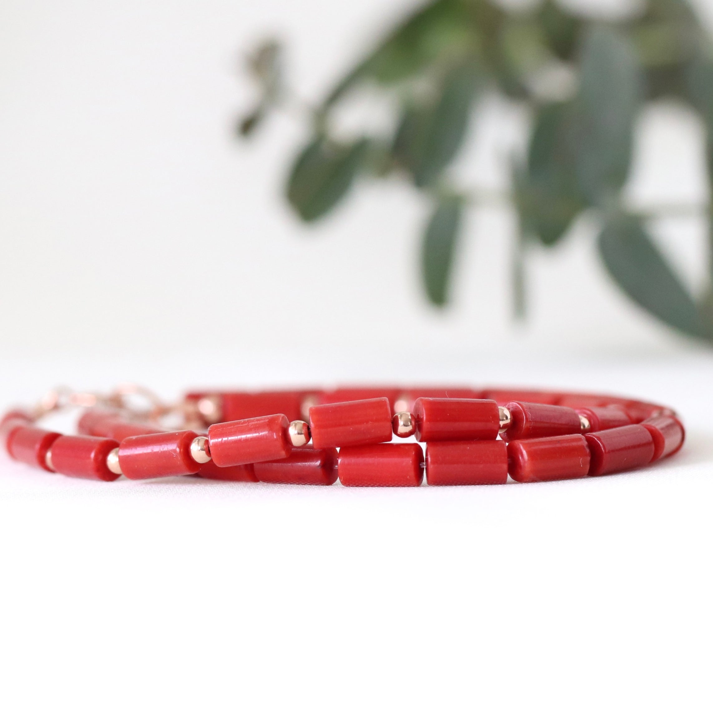 Dainty Red Coral bracelet featuring rose gold accents, timeless handmade jewelry
