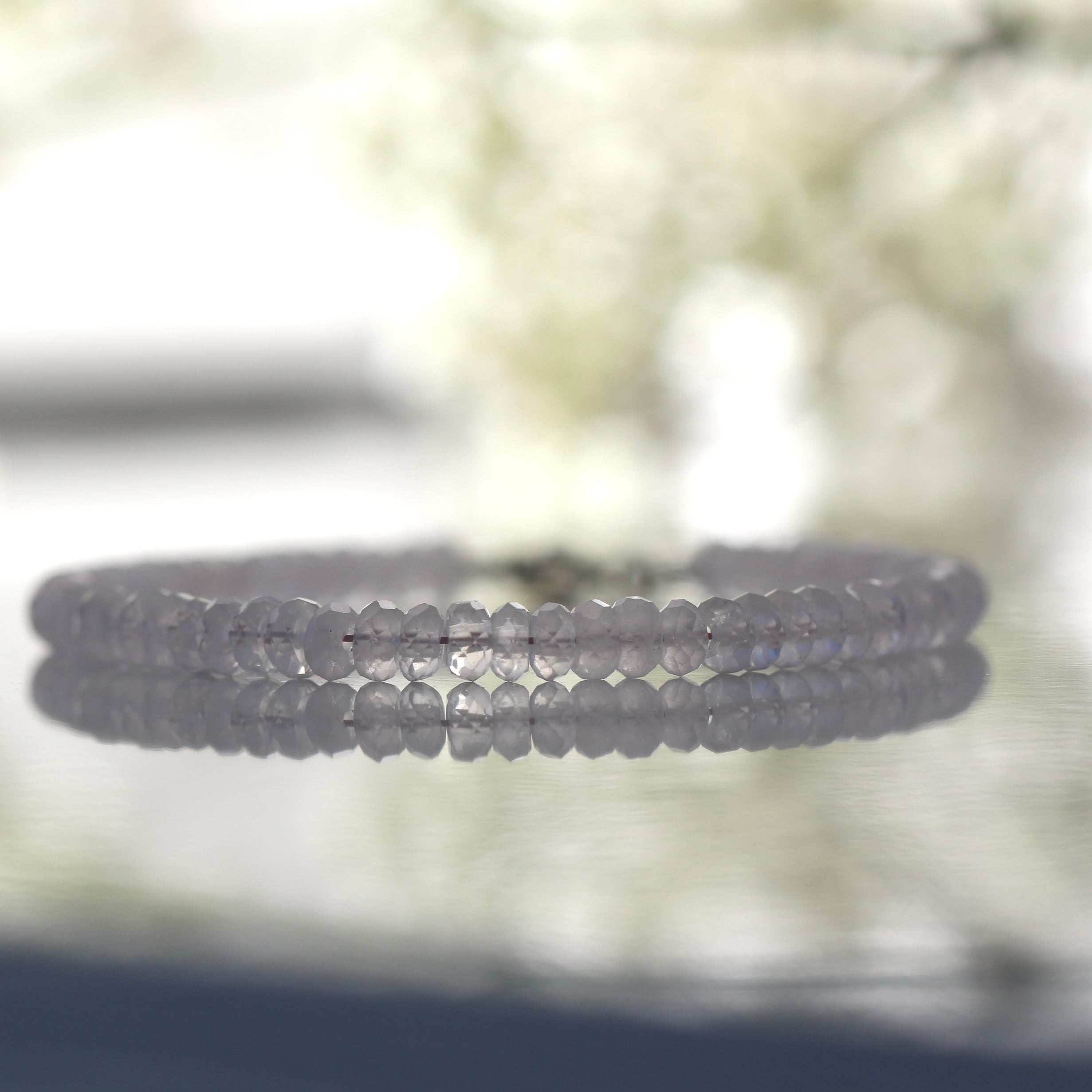 Dainty 4mm Rose Quartz bracelet featuring sterling silver clasp, elegant handmade design