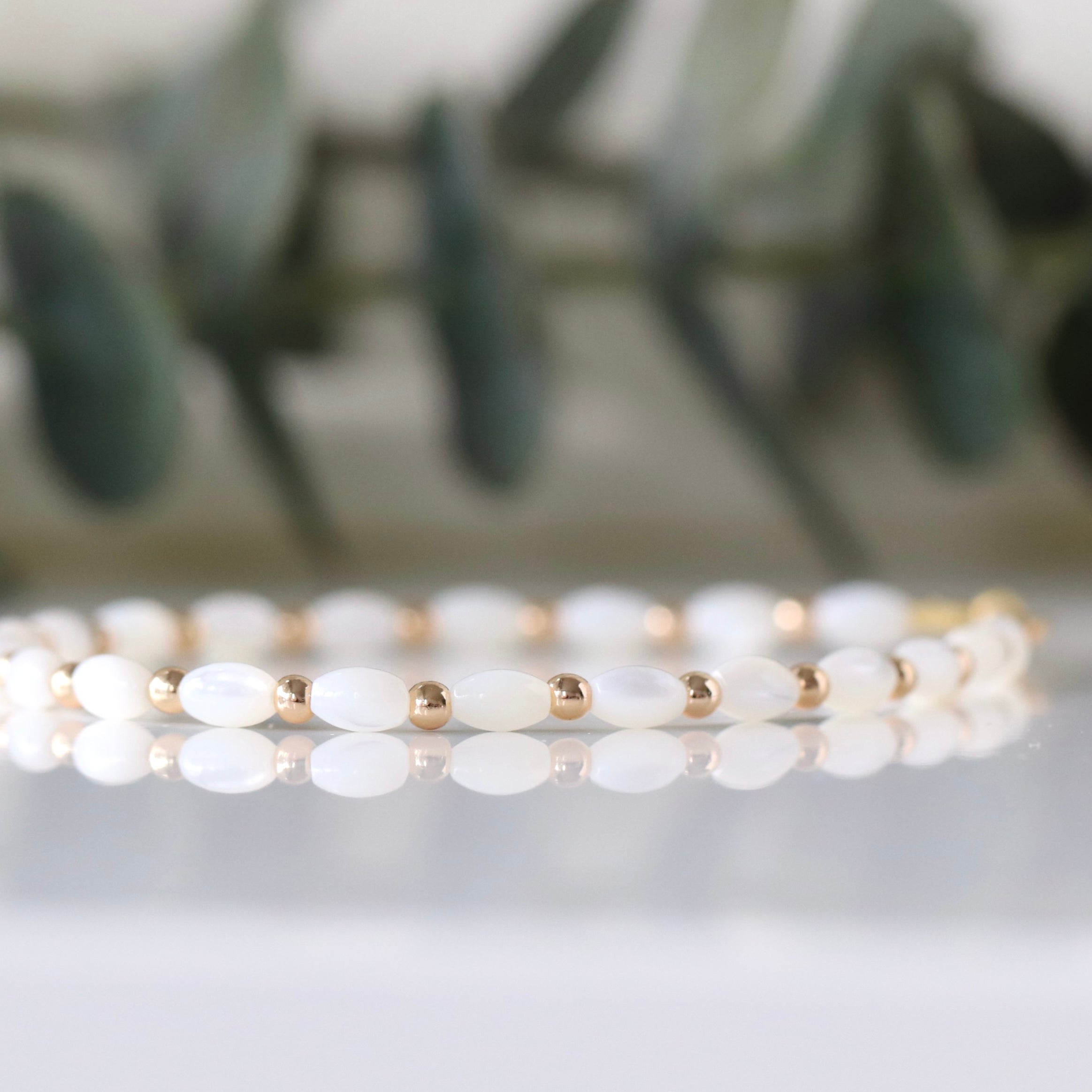 Elegant Mother of Pearl bracelet featuring gold accents