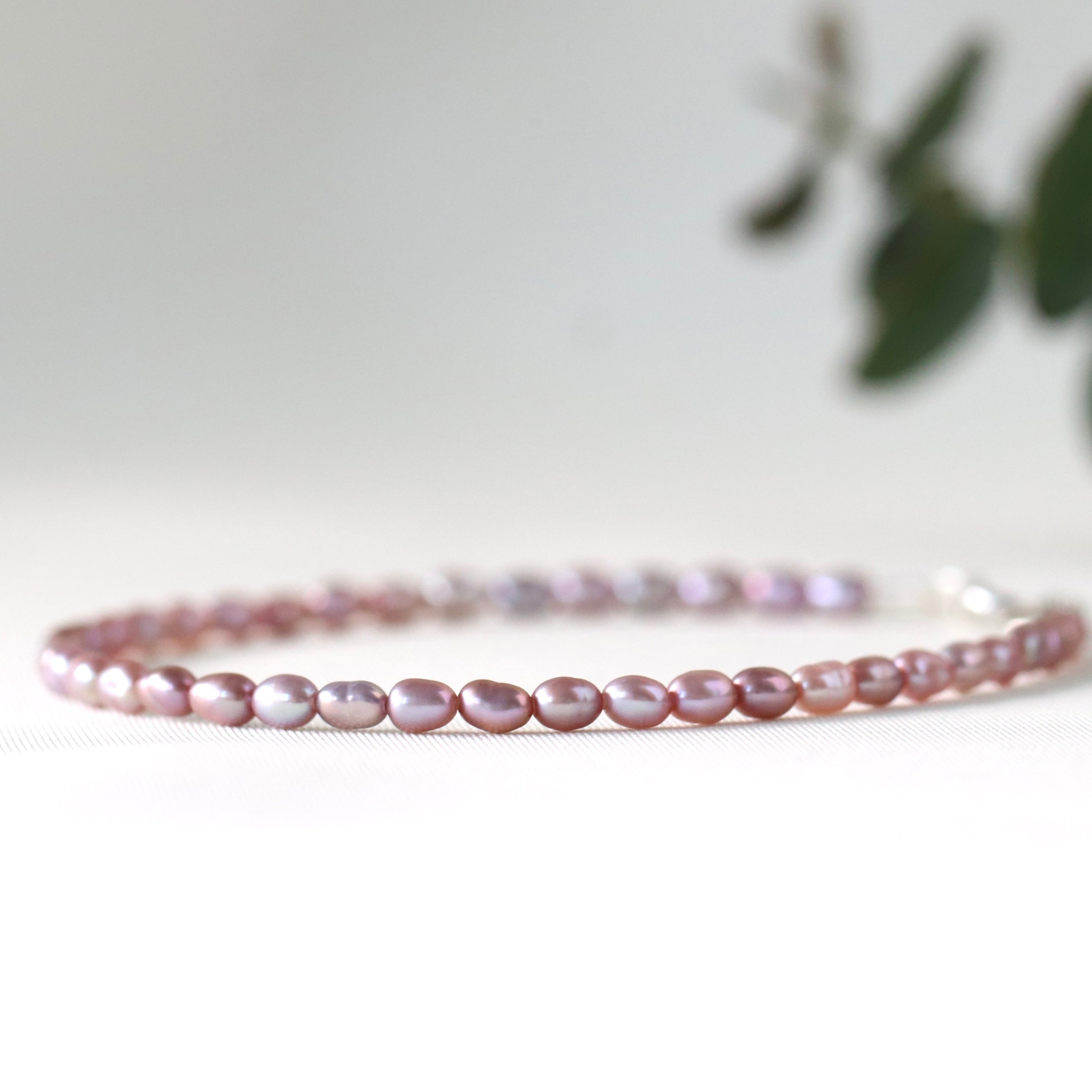 Elegant Rose Freshwater Pearl bracelet with silver accents, handcrafted by Oberia Jewelry