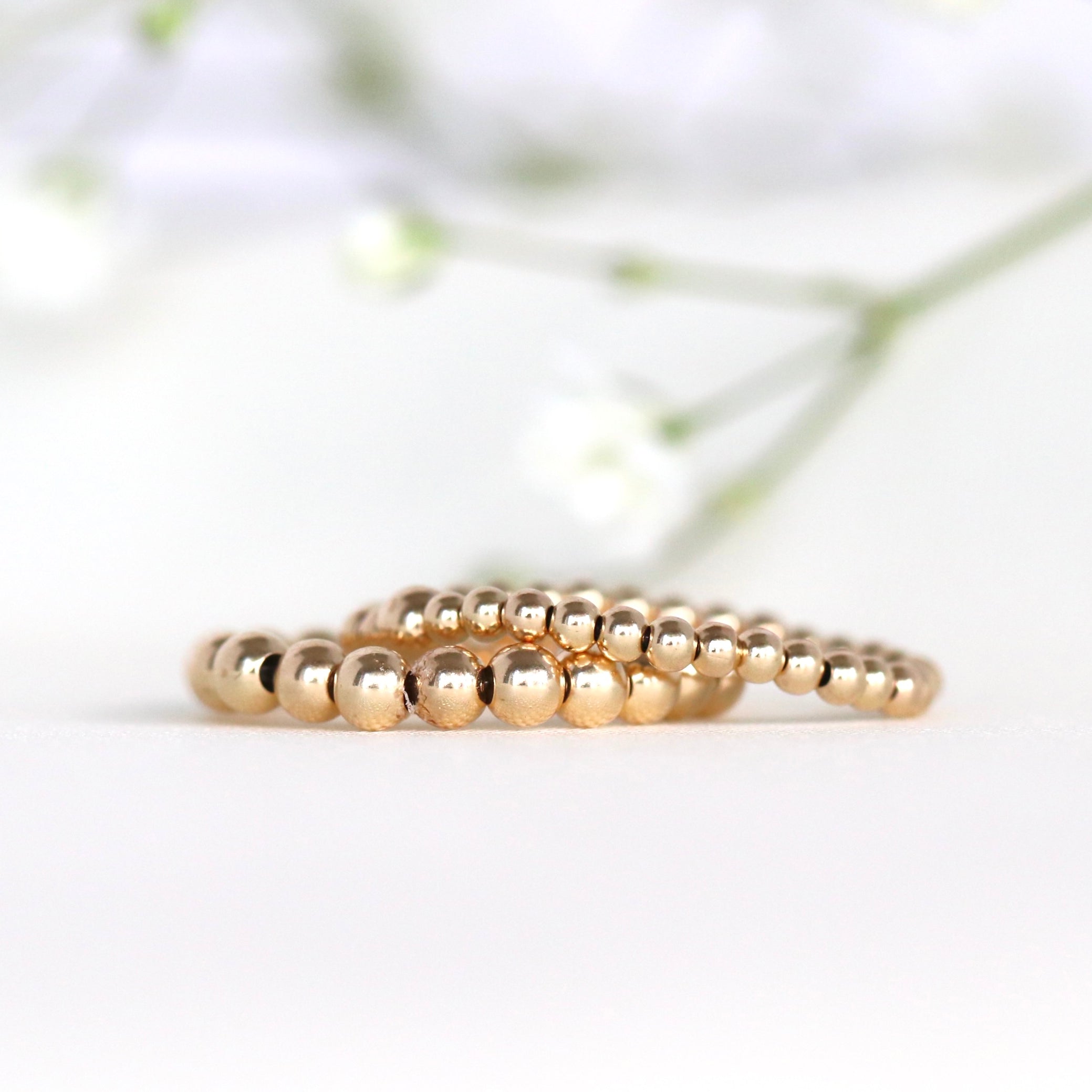 Elegant stretch ring with 14k gold filled and sterling silver beads, handcrafted by Oberia