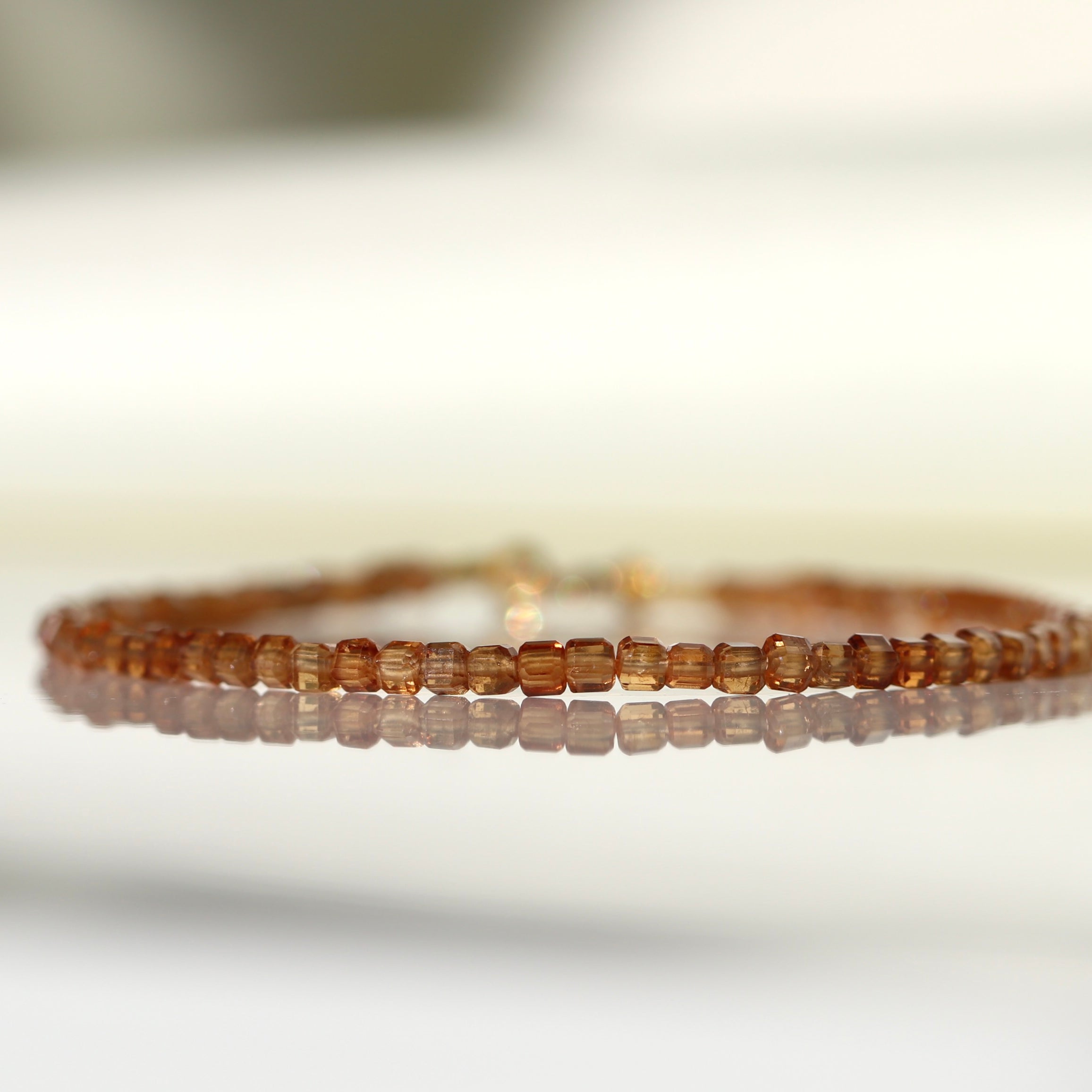 Handmade Spessartine Garnet bracelet with 2mm cube beads, elegant minimalist jewelry by Oberia