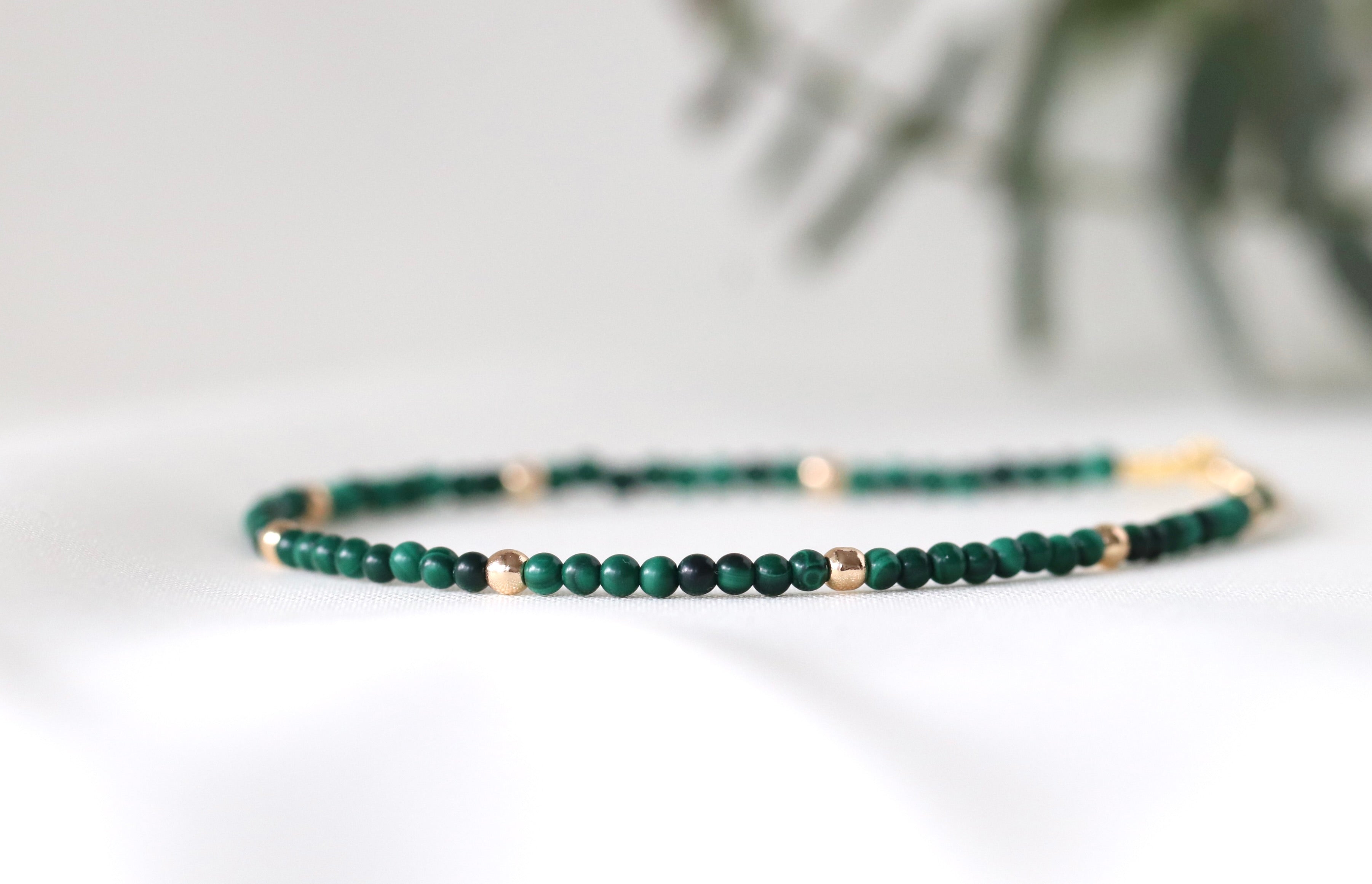 Minimalist malachite bracelet with gold accents, perfect for everyday elegance by Oberia Jewelry