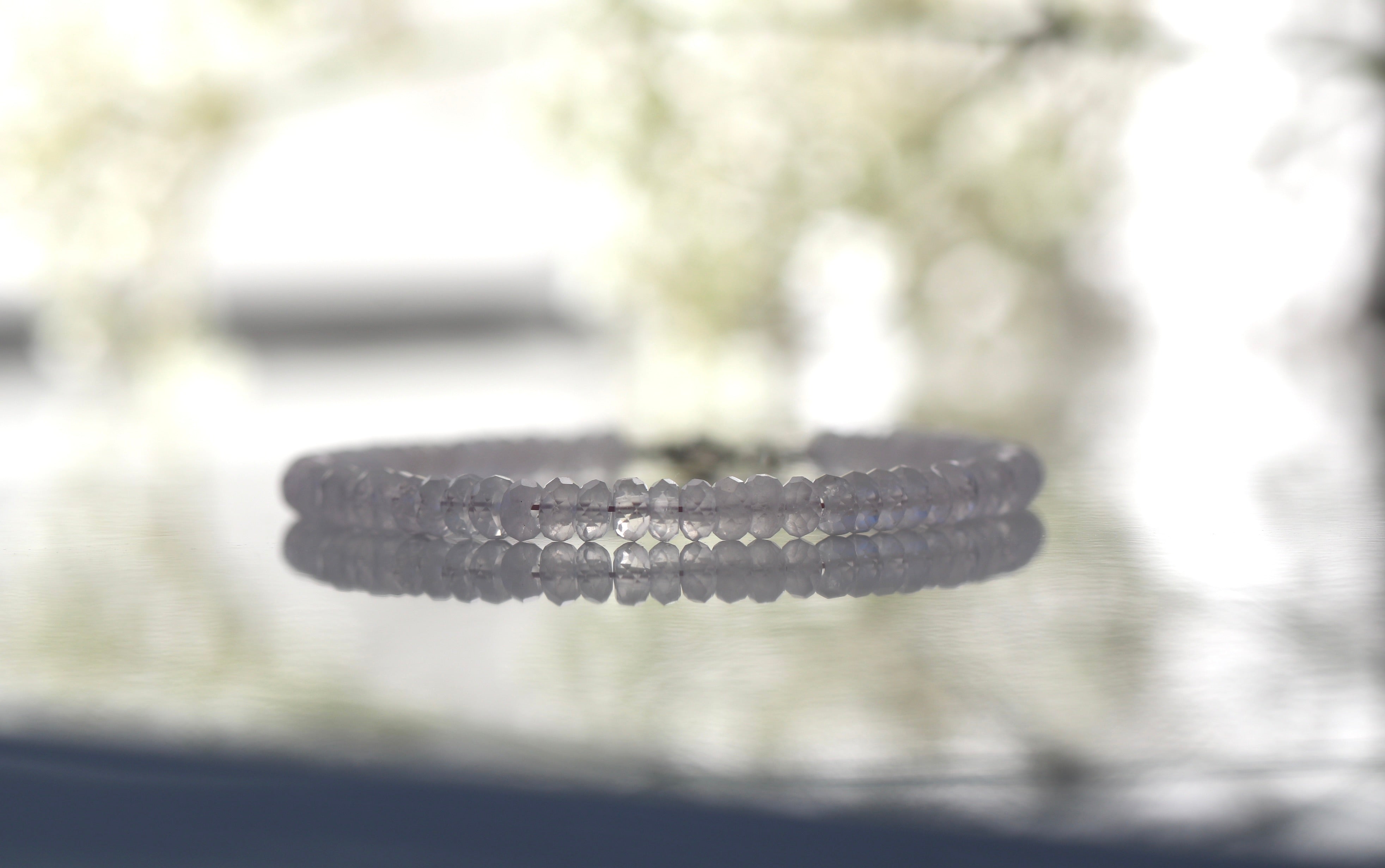 Dainty 4mm Rose Quartz bracelet featuring sterling silver clasp, elegant handmade design