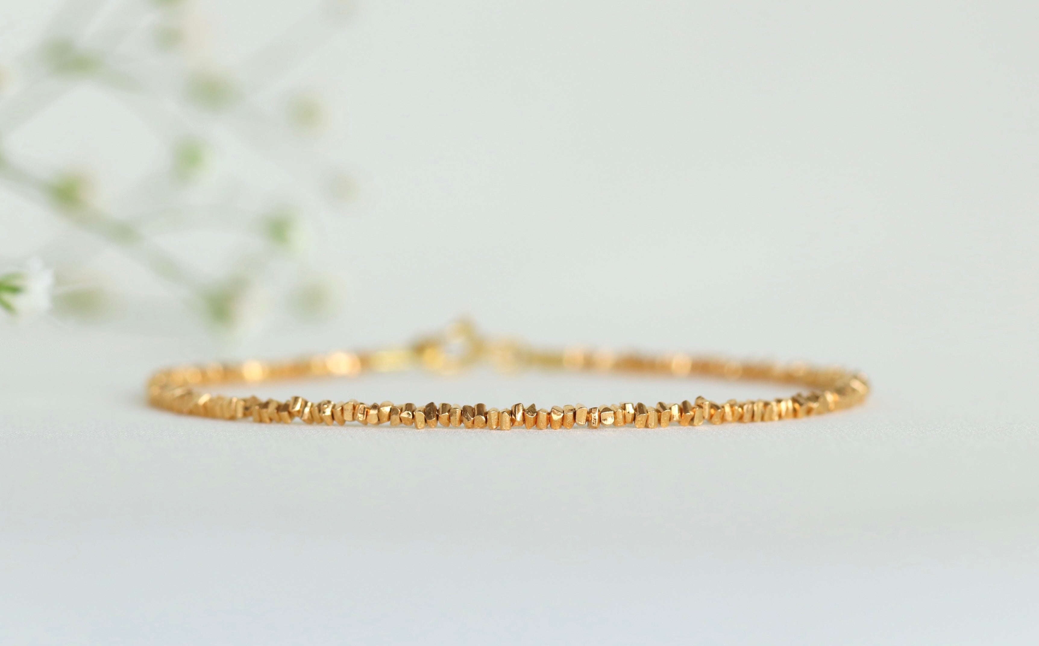 Dainty thin Karen Hill Tribe bracelet in 24k gold vermeil, elegant handcrafted design
