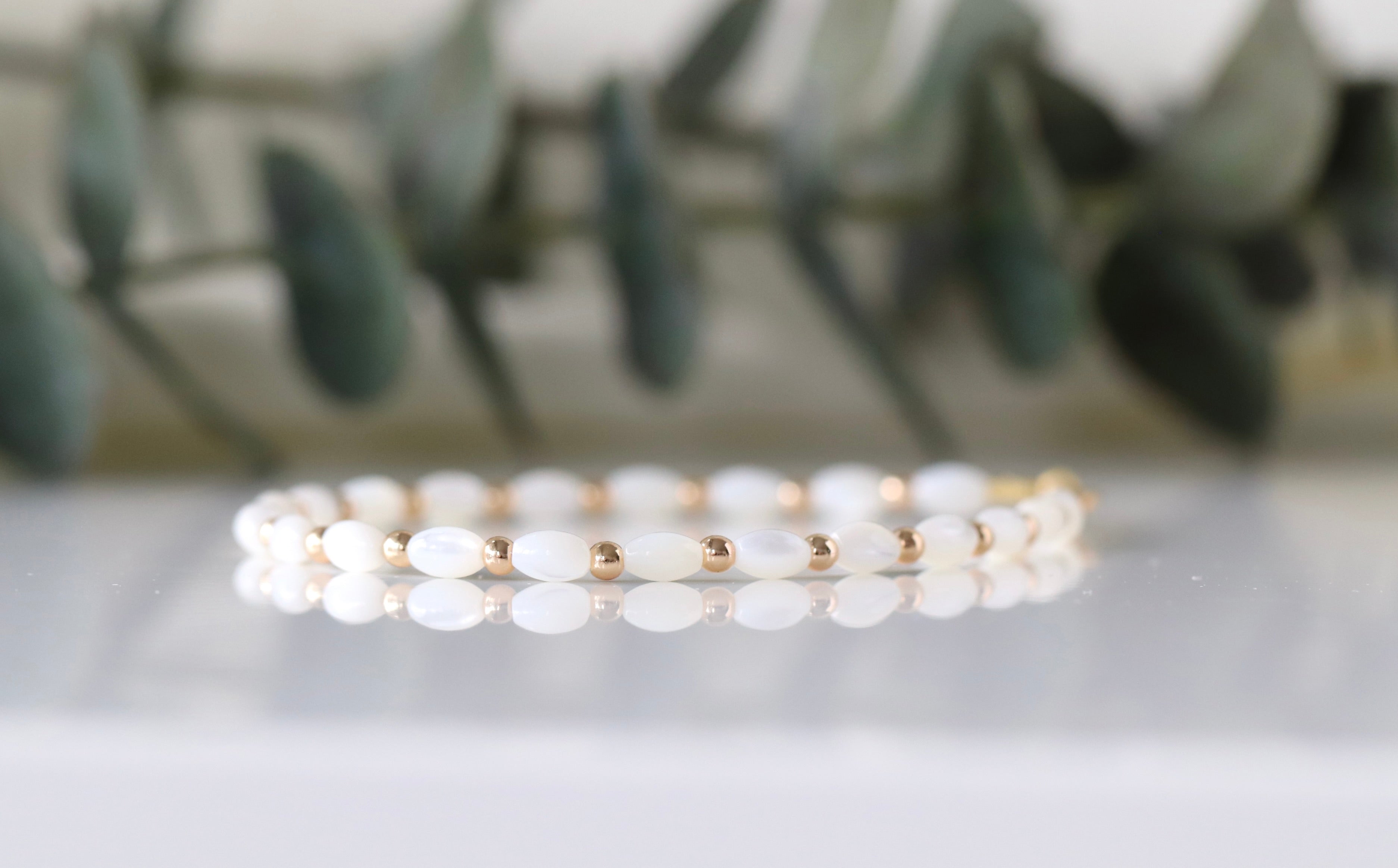 Elegant Mother of Pearl bracelet featuring gold accents