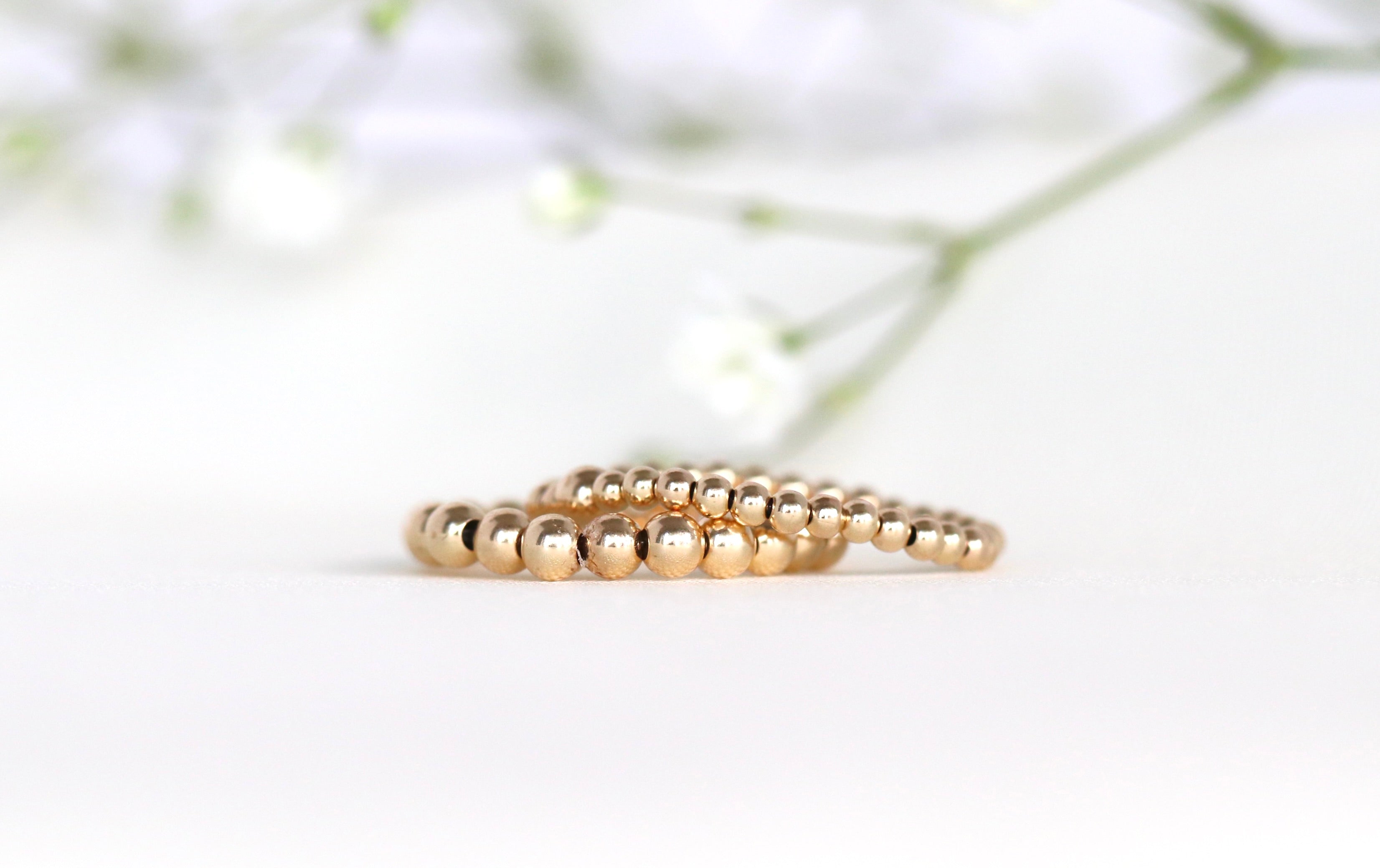 Elegant stretch ring with 14k gold filled and sterling silver beads, handcrafted by Oberia