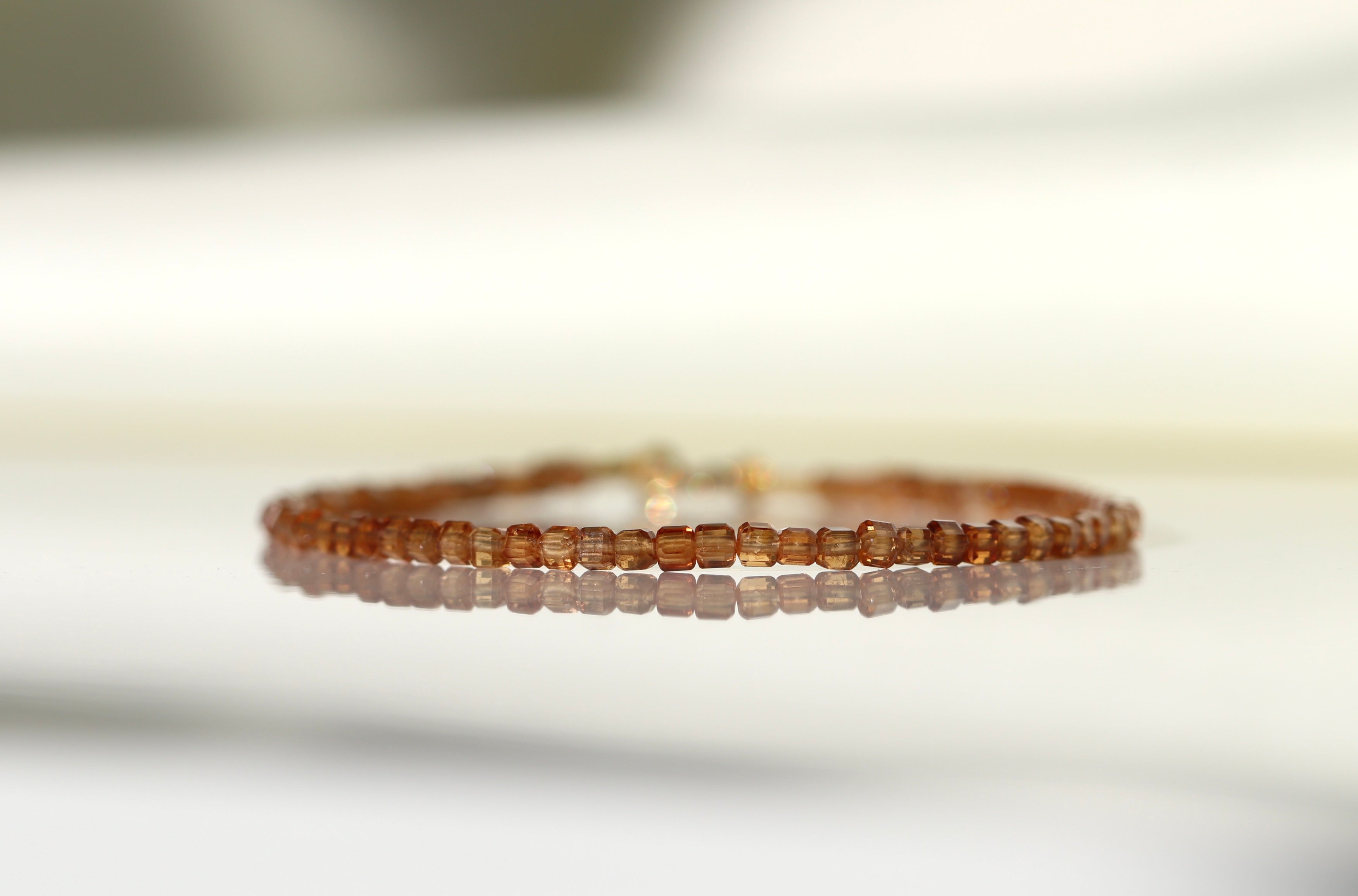 Handmade Spessartine Garnet bracelet with 2mm cube beads, elegant minimalist jewelry by Oberia