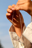 Close-up of rose luster pink freshwater rice pearls with natural shine, elegant jewelry gift for wedding or anniversary.